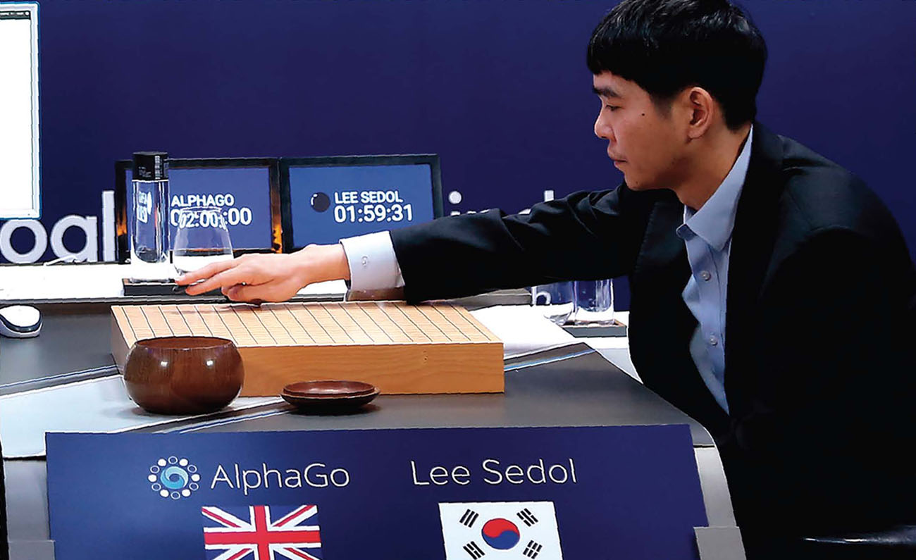 Sedol makes a move during a game of Go against a computer program called - photo 4