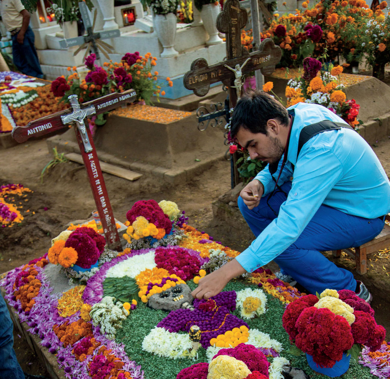 People decorate graves with flowers for the Day of the Dead On the day itself - photo 5