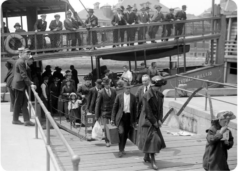 Immigrants arrive at Ellis Island in New York by sea in the early twentieth - photo 5