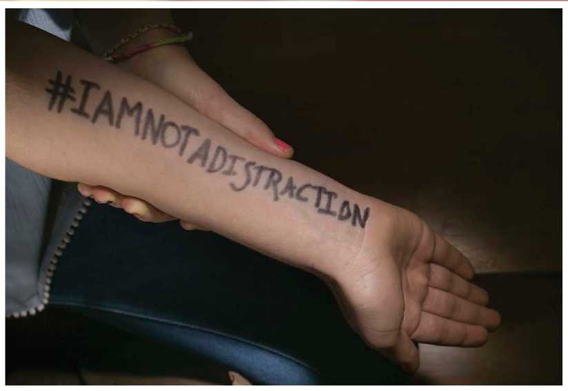 A student wrote the hashtag iamnotadistraction on her arm as part of her - photo 4