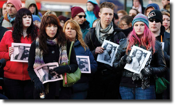 Protesters hold up signs of Rehtaeh Parsons to show their support for victims - photo 3