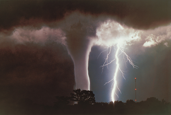 A tornado-like waterspout dances with lightning in a deadly pas de deux over - photo 4