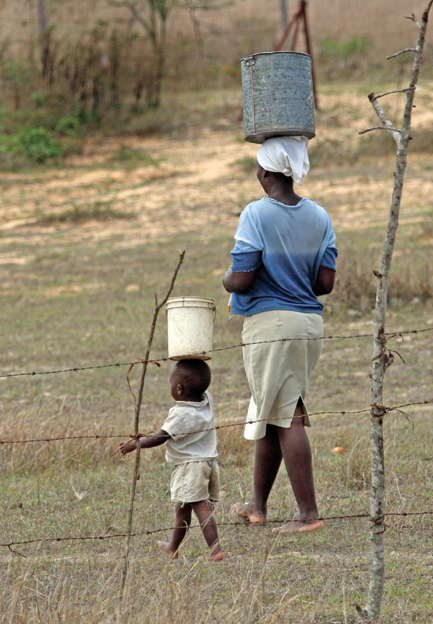 Image Credit Associated Press A mother and child in Zimbabwe carry water from - photo 3