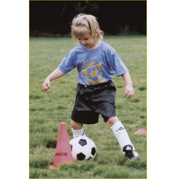 We practice dribbling the ball around orange cones toward the other teams - photo 18