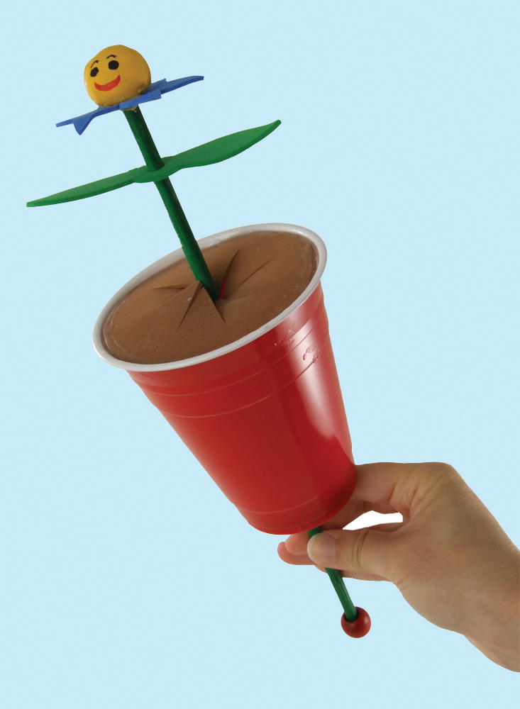 8 Gently push and pull the dowel from the bottom of the cup to make the flower - photo 10