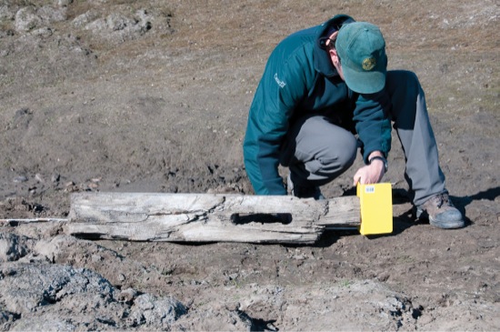 Ryan Harris examines the davit stanchion found on the east shore of Mercy Bay - photo 12
