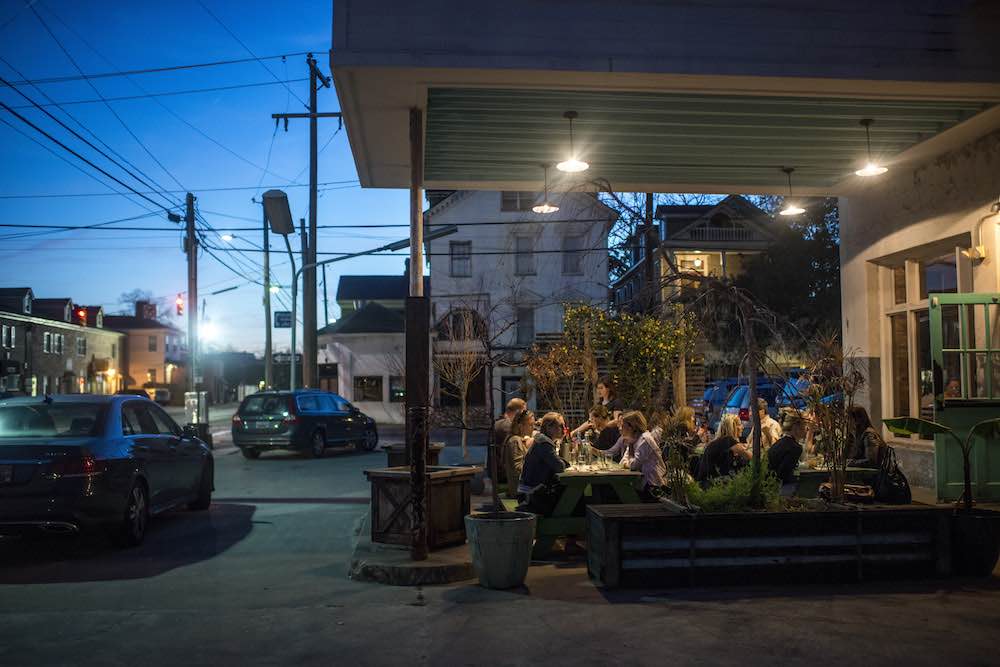 Diners outside Xiao Bao Biscuit a hipster hangout serving Asian fusion in an - photo 4