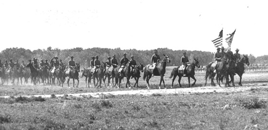 The lead troops of the famous Ninth Cavalry pass in review at Camp Funston in - photo 3