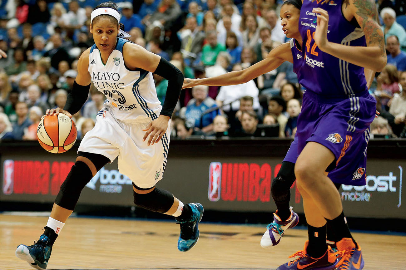 Maya dribbles the ball in a game against the Phoenix Mercury during a WNBA - photo 3