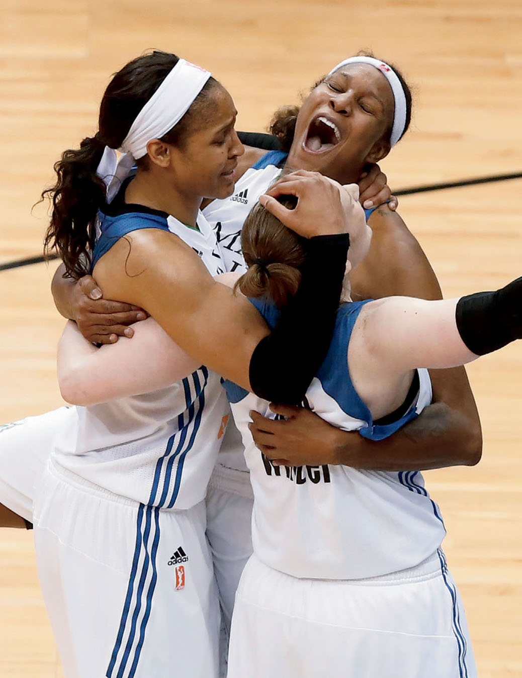 Maya celebrates the 2015 WNBA championship game win with two teammates Maya - photo 4