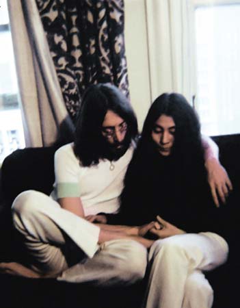 My favorite photo John and Yoko sweetly holding each others hands and looking - photo 3