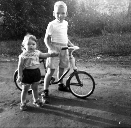 With my cousin Joy Kubancek in 1956 Behind the wheel as a toddler in the - photo 4