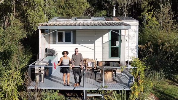 Patrick and Cori standing on the tiny house deck on their property in Dunedin - photo 3