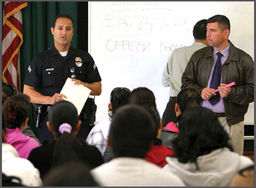 Police officers in Los Angeles California discuss with parents and community - photo 3