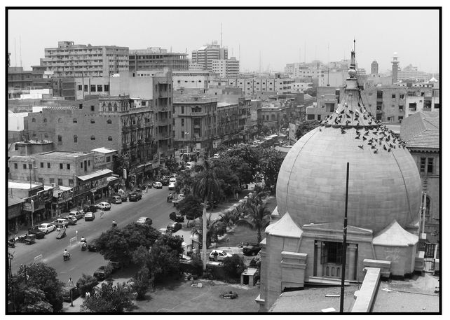 Above central Karachi To my left busy streets stretched away until they - photo 7