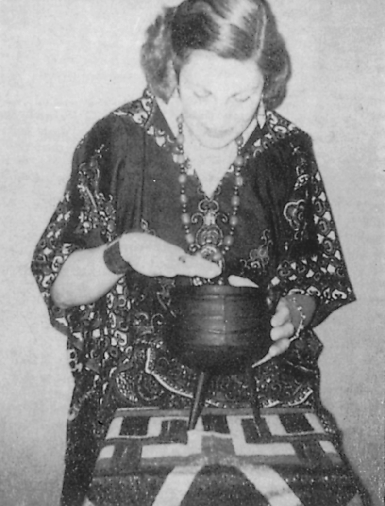 The author demonstrating the use of the water-filled cauldron for clairvoyance - photo 14