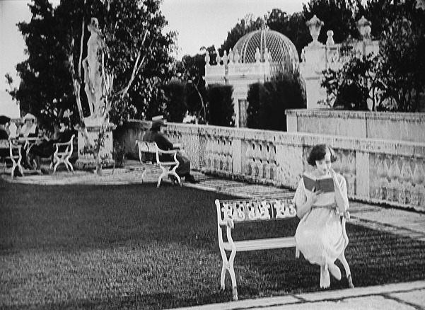 Still from the 1921 film Lessons in Love with Constance Talmadge on a bench in - photo 4