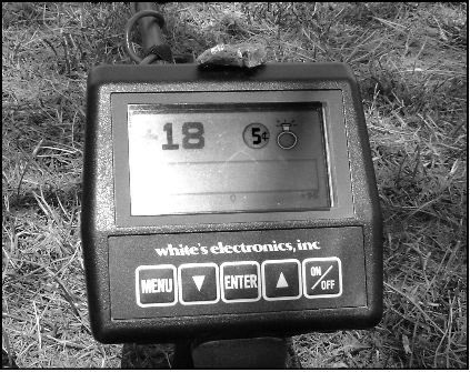 Figure 1 A modern metal detector can identify which coin it is sensing Here a - photo 1