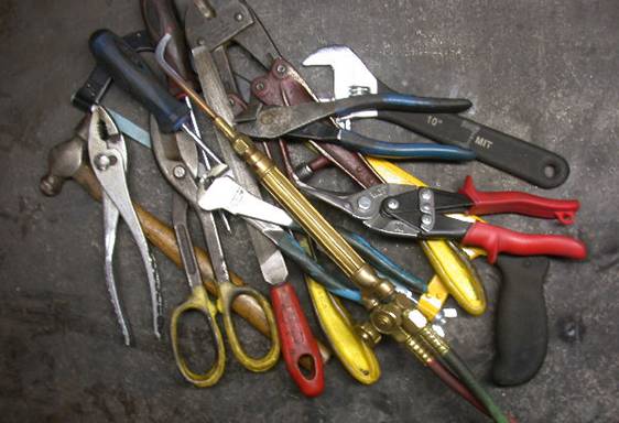 The assorted tools here are pliers adjustable wrench ball pein hammer - photo 2