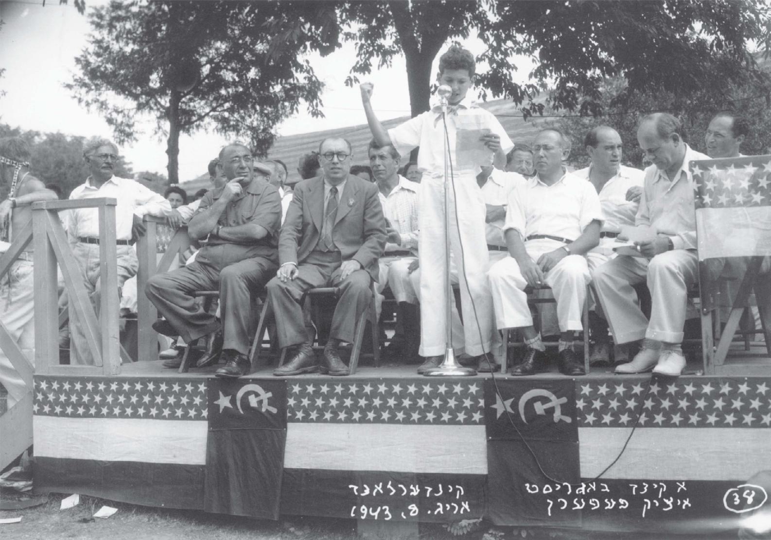 The author reading Itzhik Feffers poem I am ajew Feffer seated third from the - photo 3