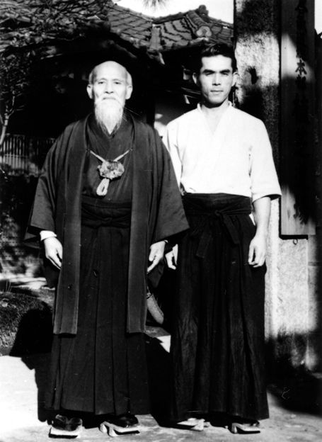 The Founder and the author standing at the front gate of the old Ueshiba Dojo - photo 6