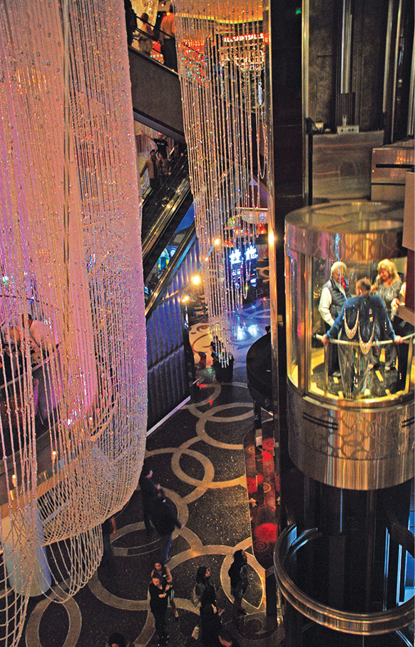 Glam chandeliers are draped throughout the lobby of The Cosmopolitan - photo 11