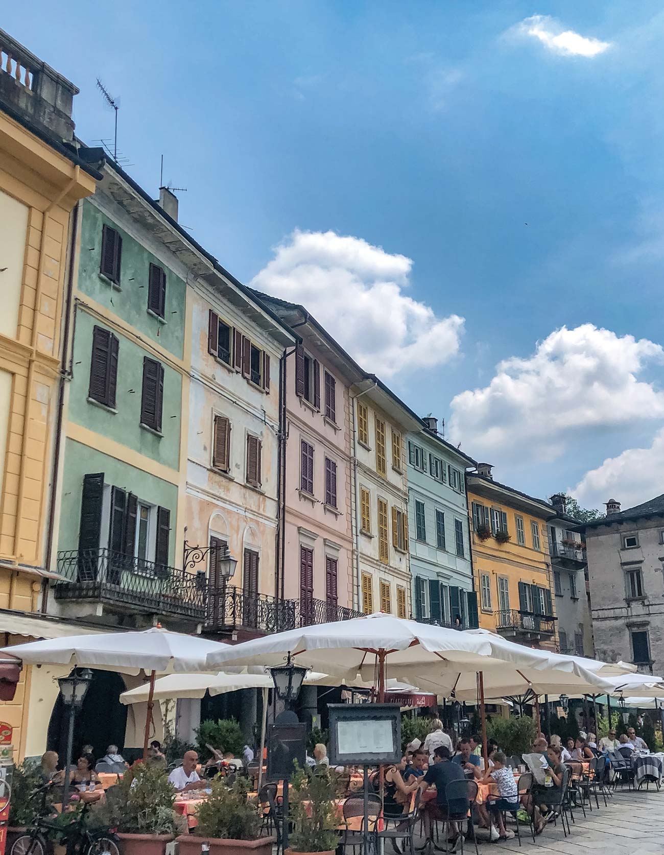 Enjoying a gelato on a shaded bench and people-watching in the heart of Orta - photo 13