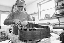 Gluing the mahogany kerfing onto the rosewood sides using binder clips as - photo 12