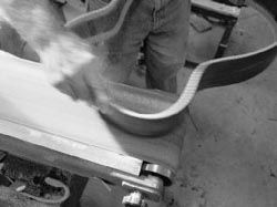 Sanding guitar sides on the belt sander Branding the back stripe with a - photo 13