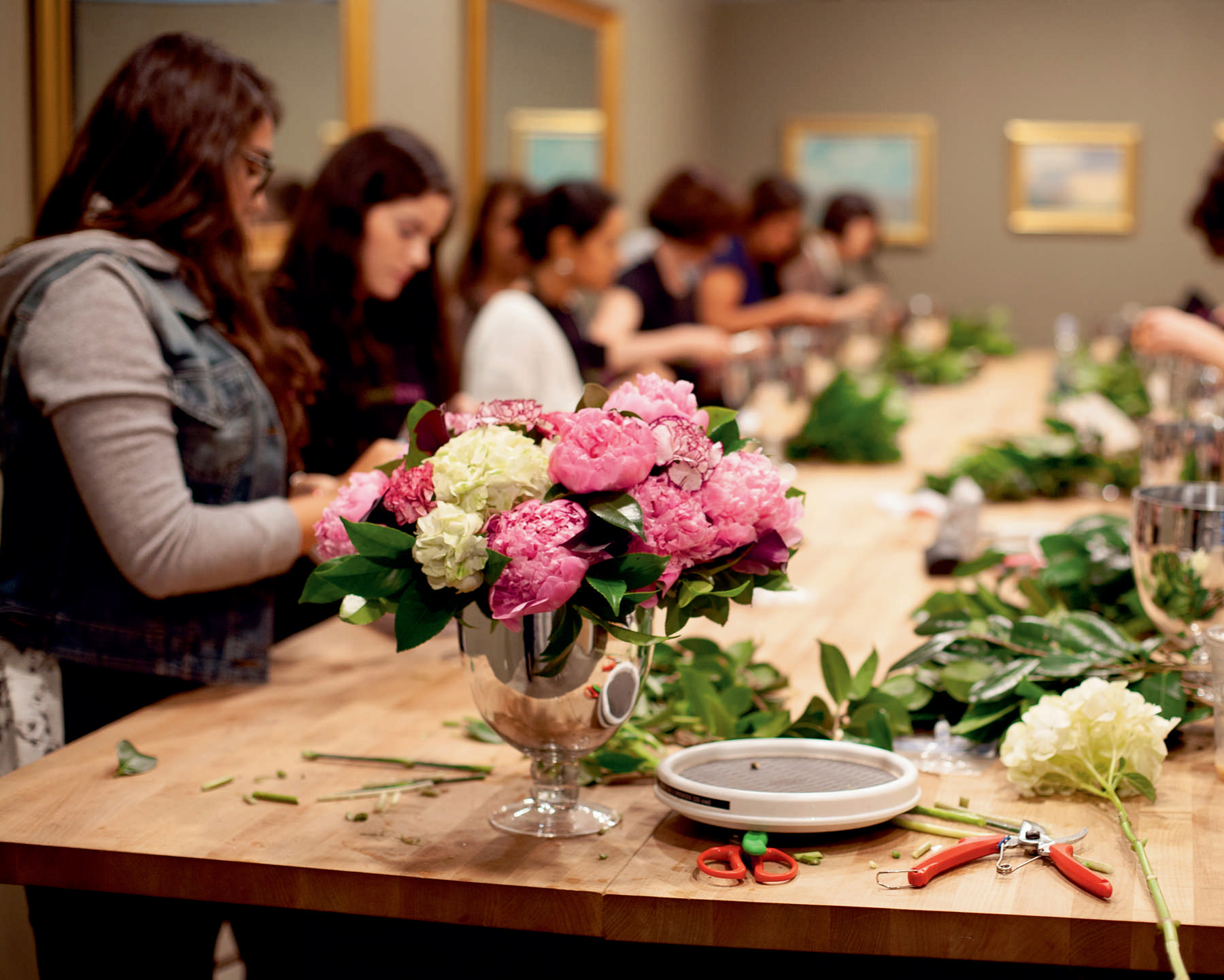 A group of burgeoning florists practices the fundamentals of flower arranging - photo 8
