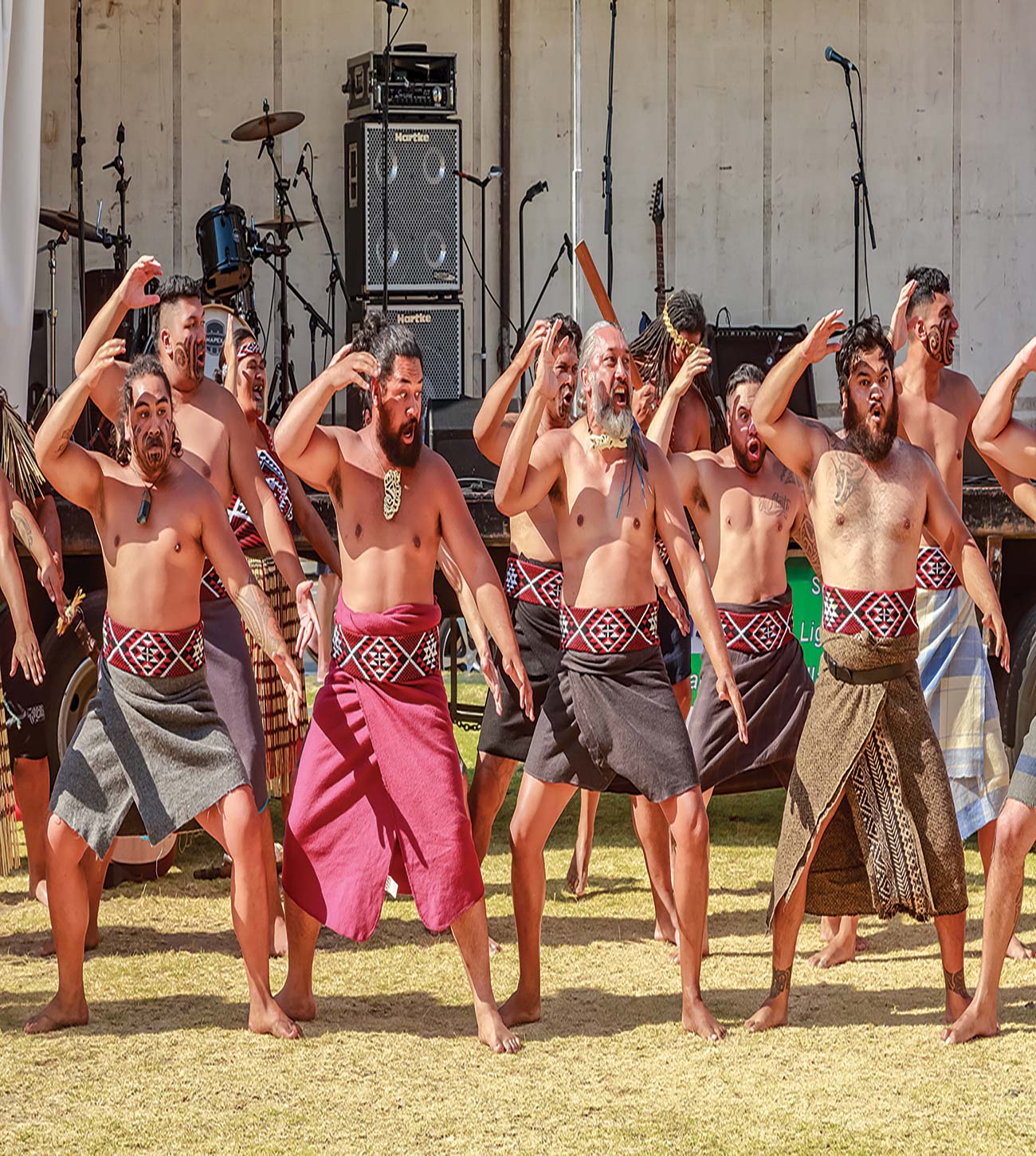 Maori men in traditional dress perform a haka cycling in Queenstown - photo 10