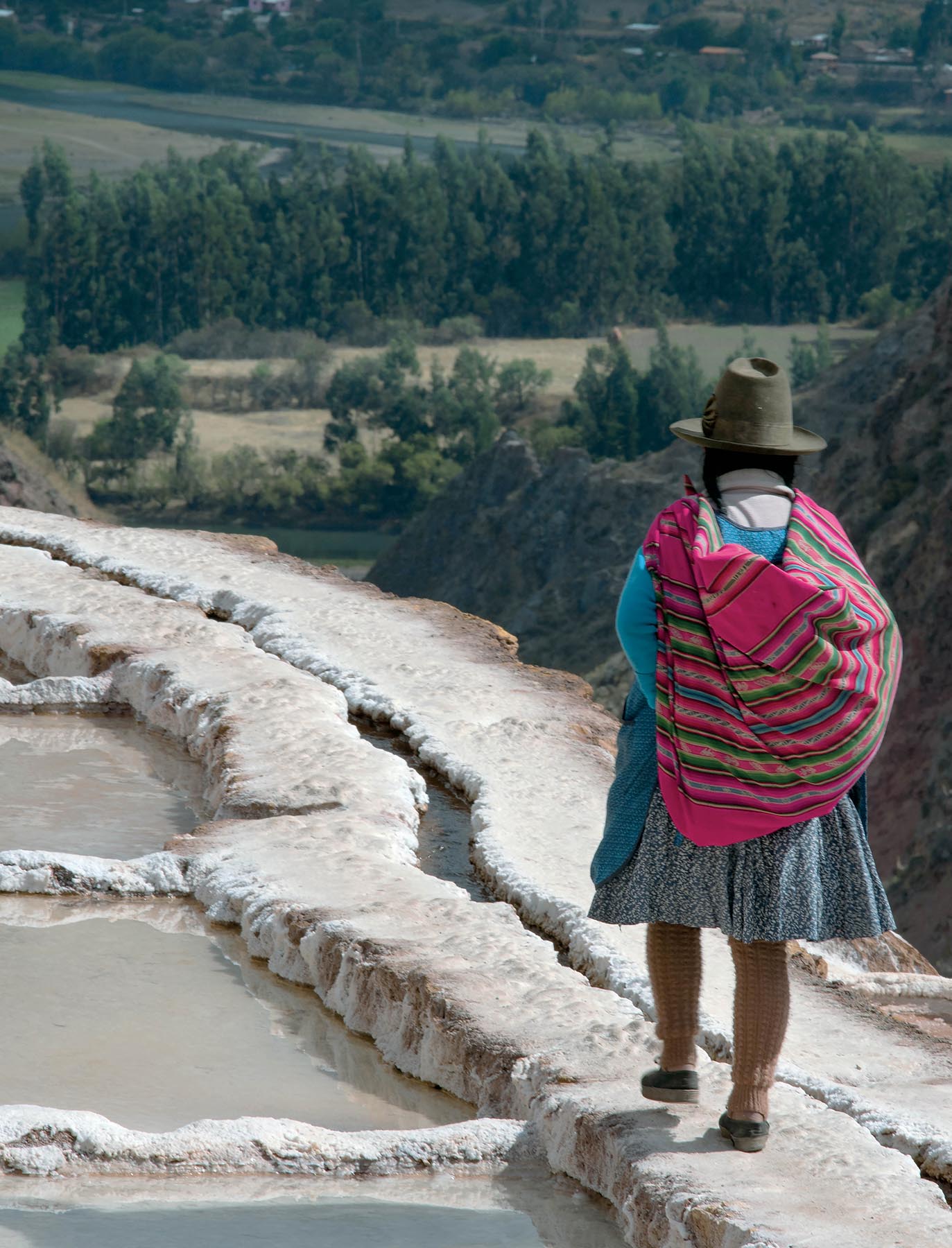 Quechua woman walking in the salt terraces of Maras Peru see The Wide - photo 6