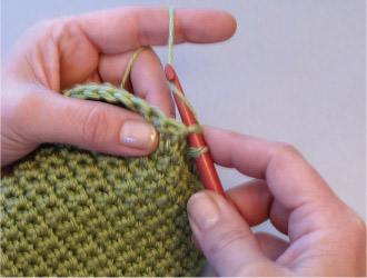 You will now have 2 loops on the hook Yarn over and pull through both loops - photo 2