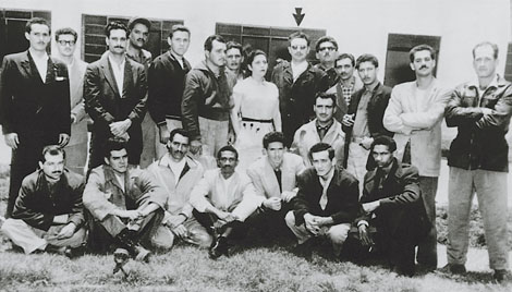 Fidel Castro under the arrow and 20 other Cuban exiles pose in front of a - photo 1