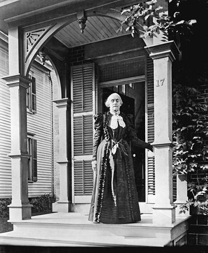 Womens rights activist Susan B Anthony stands on the porch of her familys - photo 1