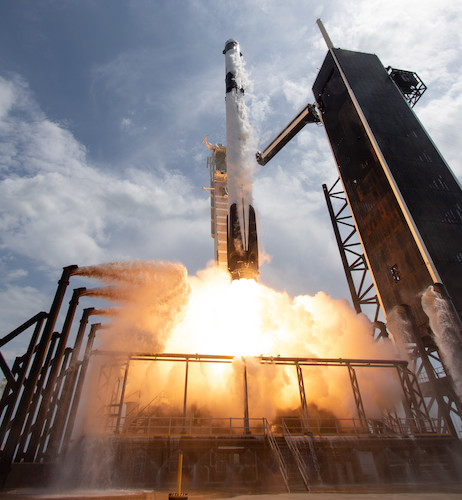 A SpaceX Falcon 9 rocket carrying the companys Crew Dragon spacecraft is - photo 3