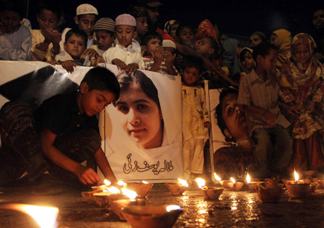 October 12 2012 People lit candles to pray for the recovery of Malala in - photo 1