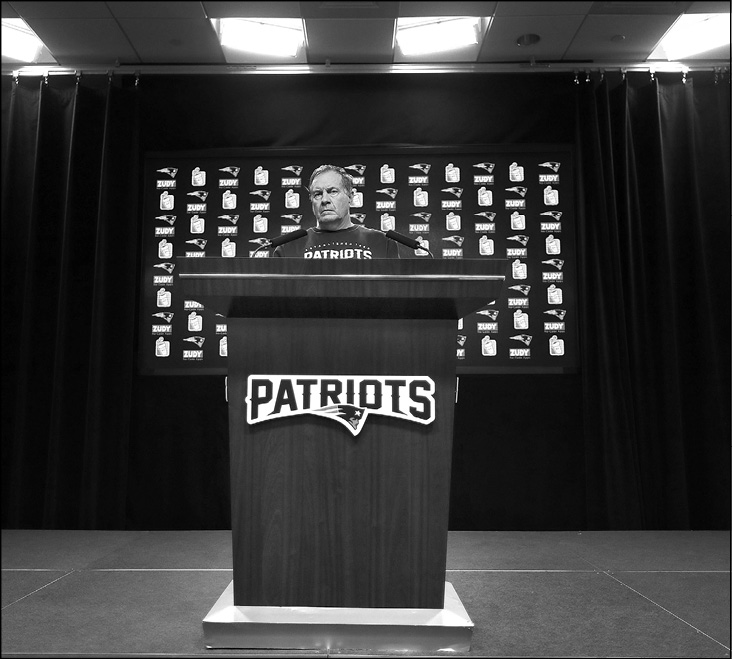 Belichick at the lectern for his daily briefing at Gillette Stadium during last - photo 3