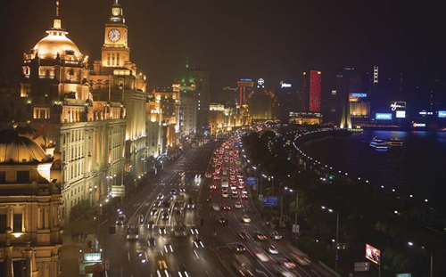 The Bund shown here lit up at night is one of the most famous streets in - photo 3