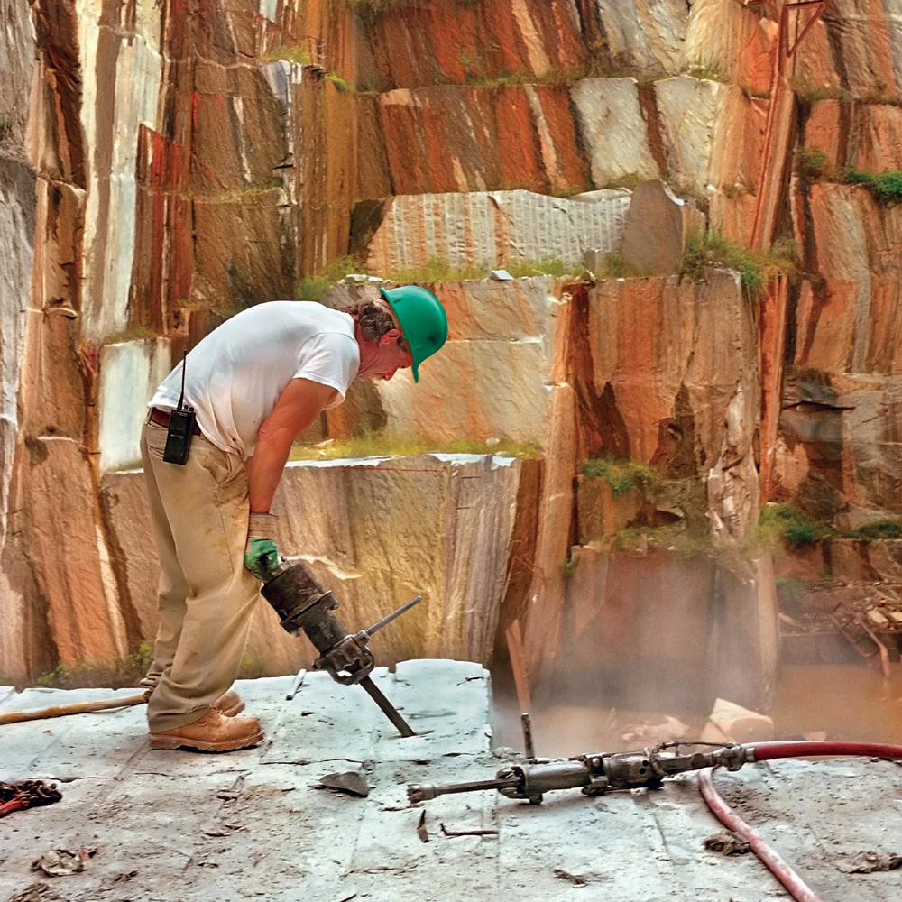 The intrusive rock granite is often used for building This man is cutting - photo 8