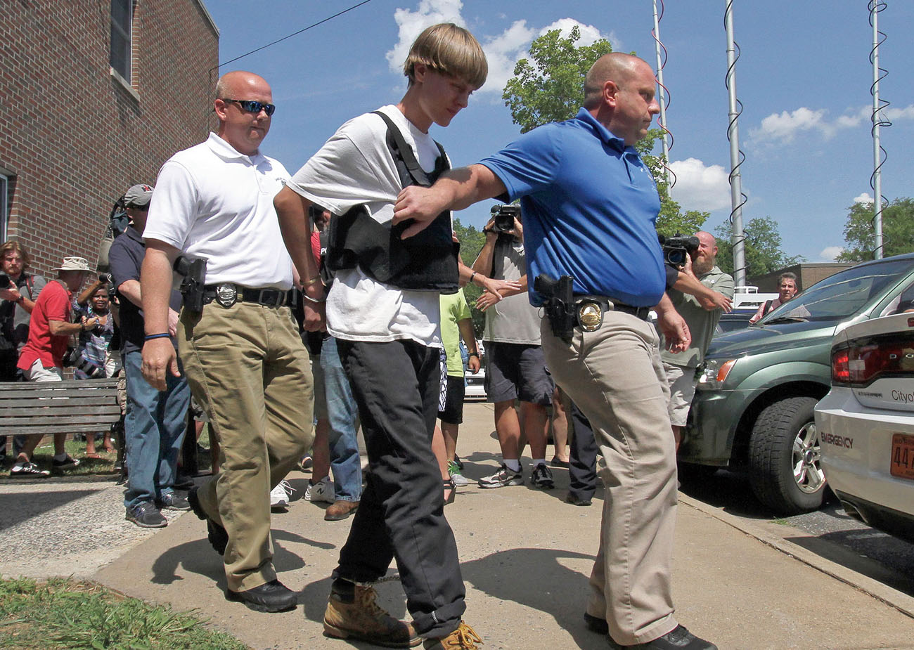 Twenty-one-year-old Dylann Roof was sentenced to life in prison after killing - photo 7