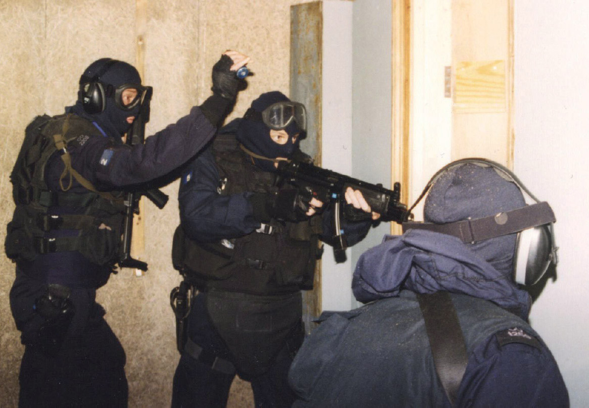 Armed with my MP5 I prepare to enter a room during live fire close quarter - photo 5