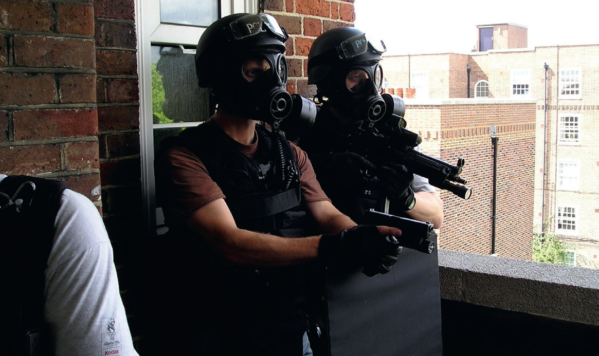 Members of Red team await the surrender of two failed suicide bombers at - photo 10