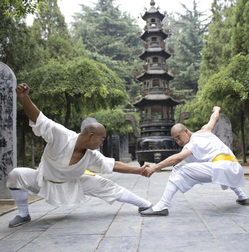 Buddhist monks practice kung fu at Shaolin Monastery on Mount Song in China - photo 8