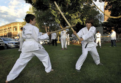 Two students practice kendo drills using shinai wooden usually bamboo - photo 9