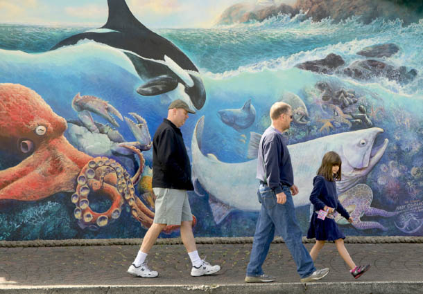 Walking in front of a mural in Old Town Florence Buoys Yaquina Bay Harbor - photo 8