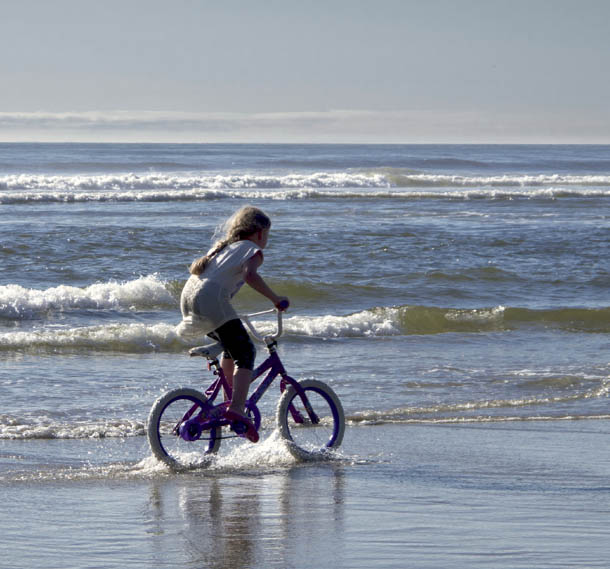 Little girl enjoying her vacation Cape Lookout State Park Surfers at Cape - photo 17