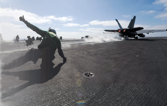 An FA-18F Super Hornet takes off from the US aircraft carrier John C - photo 14