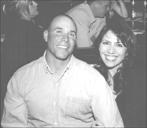 Gunny Sergeant Nick Popaditch with wife April enjoying a night out prior to his - photo 6