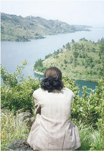 Sitting behind our house looking out over Lake Kivu when I returned to my - photo 6